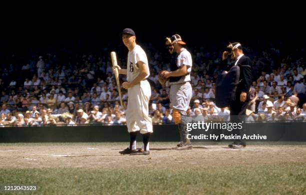 Al Kaline of the Detroit Tigers looks down to his third base coach to get the sign during an MLB game against the Baltimore Orioles on June 28, 1959...