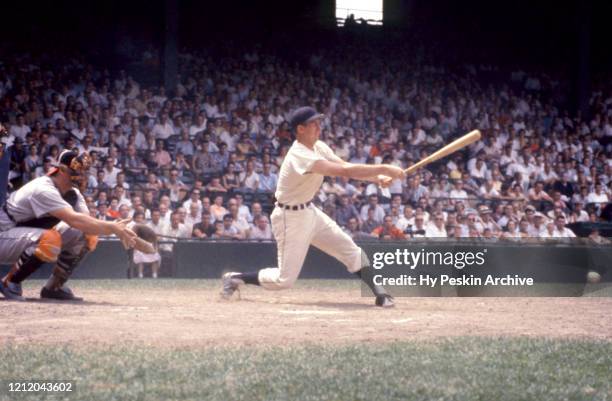 Al Kaline of the Detroit Tigers swings at the pitch during an MLB game against the Baltimore Orioles on June 28, 1959 at Briggs Stadium in Detroit,...