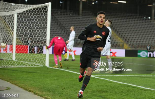 Mason Greenwood of Manchester United celebrates scoring their fourth goal goal during the UEFA Europa League round of 16 first leg match between LASK...