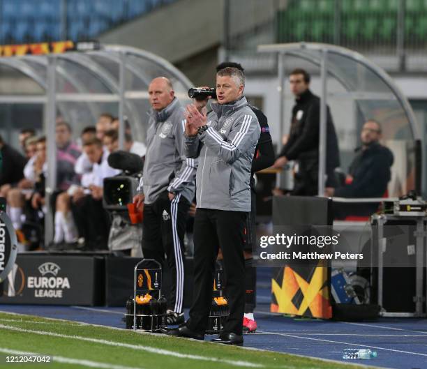 Manager Ole Gunnar Solskjaer of Manchester United watches from the bench during the UEFA Europa League round of 16 first leg match between LASK and...