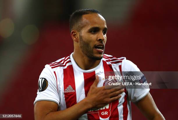 In this handout image provided by UEFA, Youssef El Arabi of Olympiacos FC celebrates after scoring his team's first goal during the UEFA Europa...