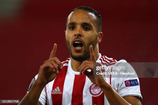 In this handout image provided by UEFA, Youssef El Arabi of Olympiacos FC celebrates after scoring his team's first goal during the UEFA Europa...