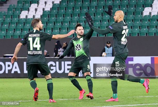 In this handout image provided by VfL Wolfsburg, John Anthony Brooks of VfL Wolfsburg celebrates after scoring his team's first goal with Renato...