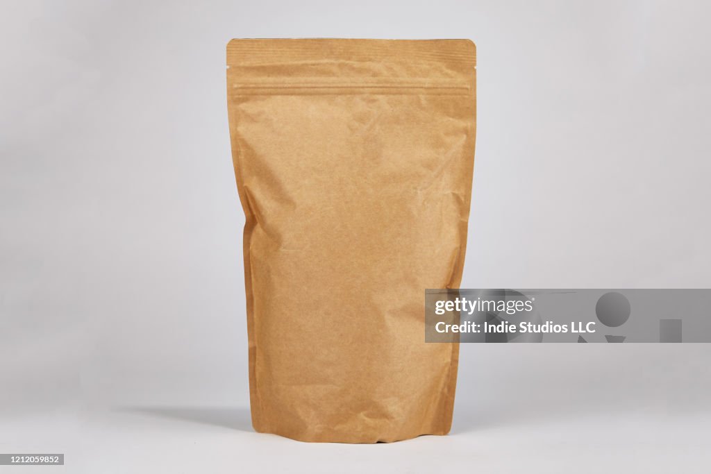 Stand up Brown Paper Zipper Pouch Centered in Frame with Space for Copy