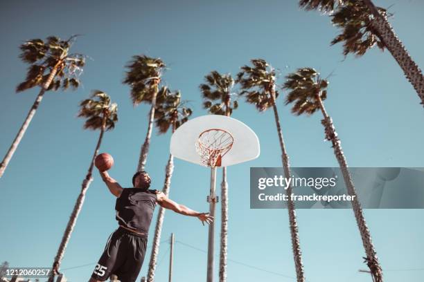 basketball player taking a shoot - street basketball imagens e fotografias de stock