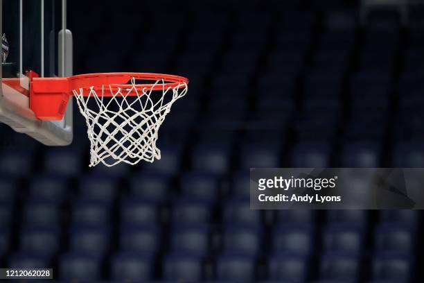 The basket and the arena sit unused after the announcement of the cancellation of the SEC Basketball Tournament at Bridgestone Arena on March 12,...
