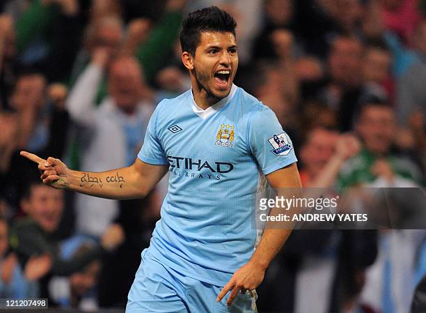 Manchester City's Argentinian forward Sergio Aguero celebrates after scoring during the English Premier League football match between Manchester City...