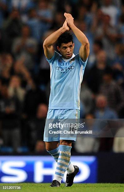 Sergio Aguero of Manchester City applauds the supporters after scoring his side's fourth goal during the Barclays Premier League match between...