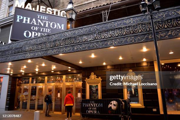 People read a notification at the Majestic Theatre that Broadway productions have been suspended on March 12, 2020 in New York City. As the...