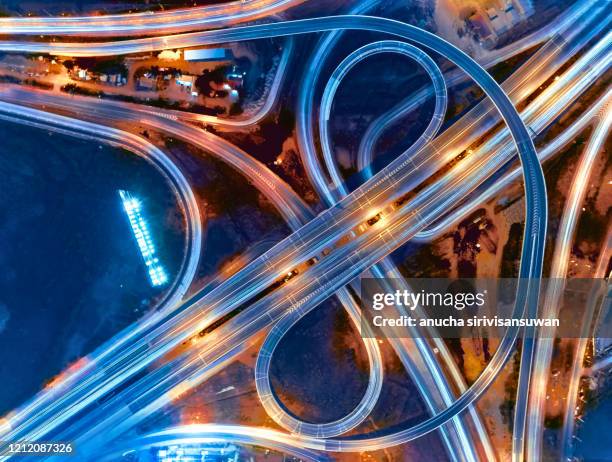 aerial top view of bangkok roundabout road at night, thailand. - intersection stock pictures, royalty-free photos & images