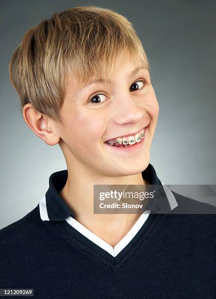smiling boy - boys with braces stock pictures, royalty-free photos & images