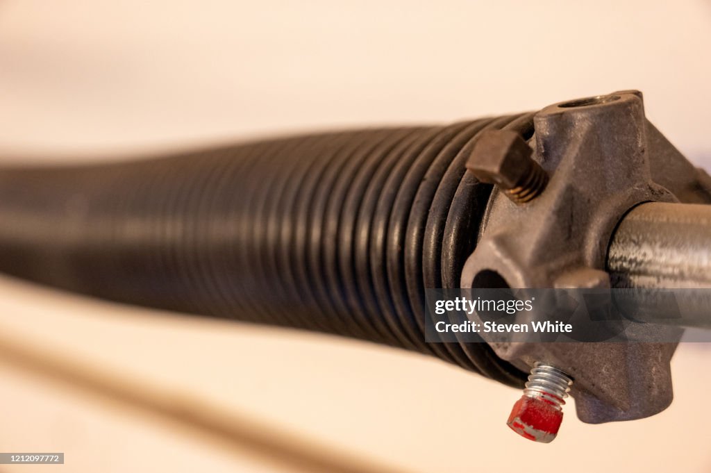 Coil Spring Side View Loop Close Up Side View Of Garage Door Coiled Spring High-Res Stock Photo ...
