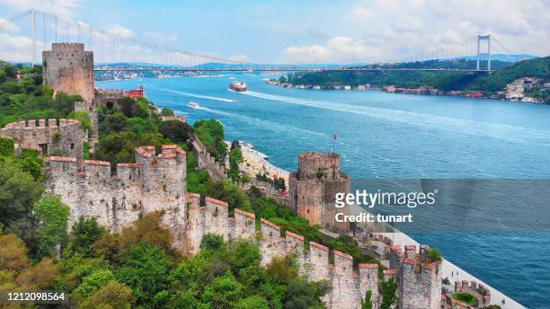 view of bosphorus strait and fatih sultan mehmet bridge in istanbul - istanbul stock pictures, royalty-free photos & images