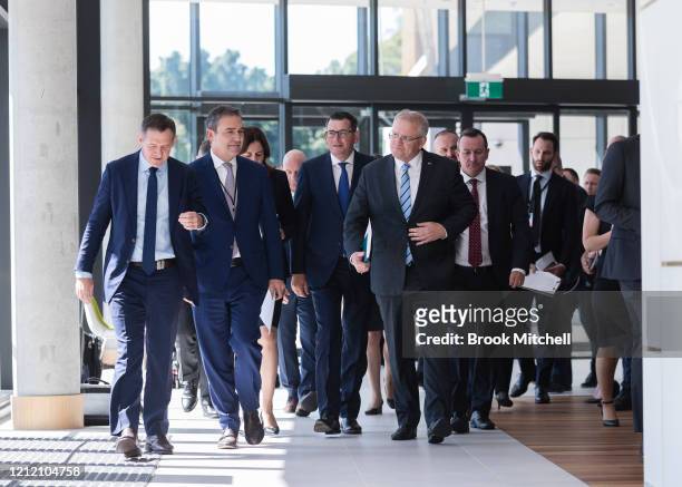 Prime Minister Scott Morrison is flanked by State and Territory leaders as they arrive for a press conference during which the announcement was made...