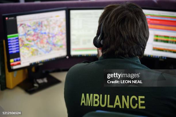 South Central Ambulance Service call handler from the National Covid Centre team speaks to a patient at the clinical coordination centre on May 5,...