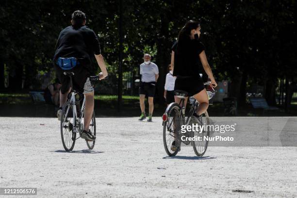Cyclists ride in the Parco Sempione in Milan after lockdown loosening, May 07, 2020.
