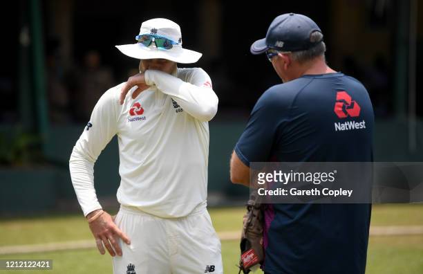 England captain Joe Root speaks with coach Chris Silverwood during the tour match between SLC Board President's XI and England at P Sara Oval on...