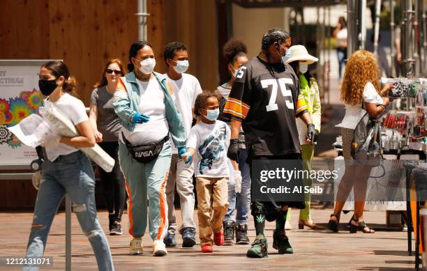 Families and friends shopping at FIGat7th, an open-air shopping mall located at 735 S Figueroa St. In the Financial District of Downtown Los Angeles...