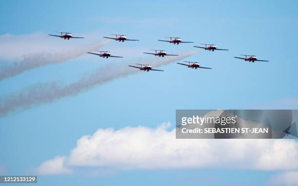 The Snowbirds, the Royal Canadian Air Force air acrobatics team, fly over Montreal in a morale-building tour of Canada called "Operation...