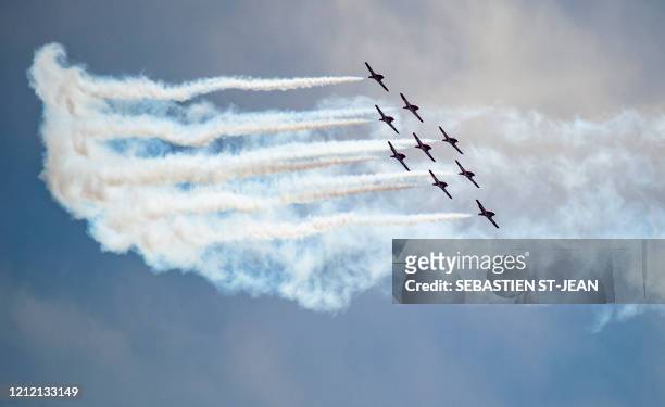 The Snowbirds, the Royal Canadian Air Force air acrobatics team, fly over Montreal in a morale-building tour of Canada called "Operation...