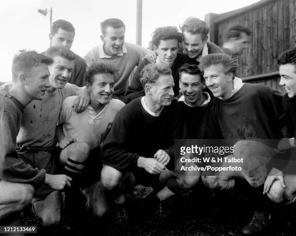 Tom Finney of Preston North End talking to some of the younger players, including Peter Thompson after a training session in Preston, England, circa...