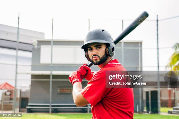 bearded hispanic baseball player outdoors in batting stance - high school baseball stock pictures, royalty-free photos & images