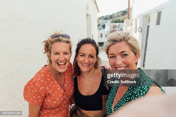 cheerful female friends taking selfie on holiday - portrait of a woman 40 50 summer stock pictures, royalty-free photos & images