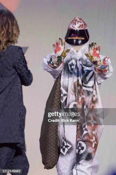 Honoree Erykah Badu accepts an award from host Parker Posey at the Austin Film Society's Texas Film Awards 20th Anniversary at Austin Studios on...