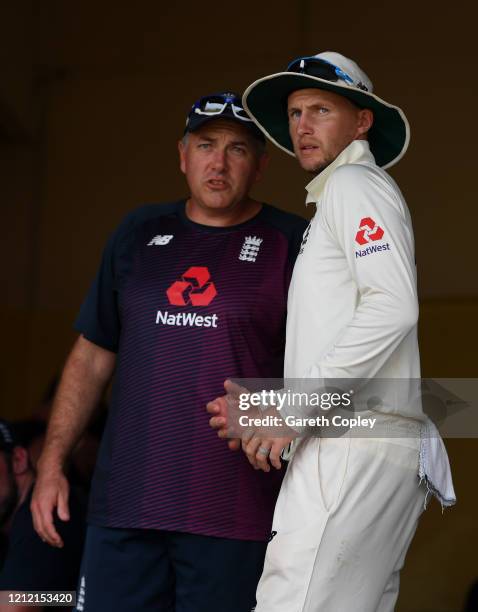 England captain Joe Root speaks with coach Chris Silverwood ahead of the tour match being abandoned between SLC Board President's XI and England at P...