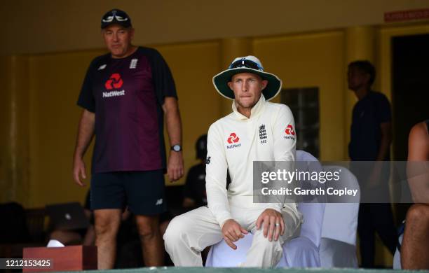 England captain Joe Root speaks with coach Chris Silverwood ahead of the tour match being abandoned between SLC Board President's XI and England at P...