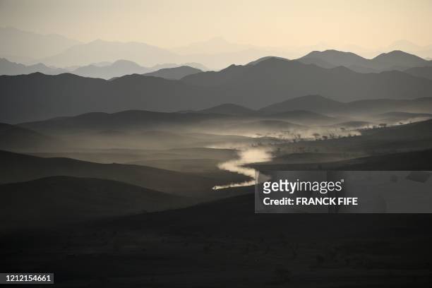 File picture taken on January 6, 2020 during the Dakar 2020 car racing shows a general view of Saudi Arabia's northwestern region, between Neoam and...