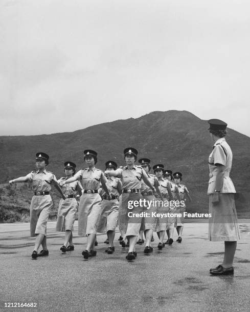 Sub-Inspector Margaret Patrick oversees the training of fifty-five female recruits to the Hong Kong Police Force, at the Aberdeen Police Training...