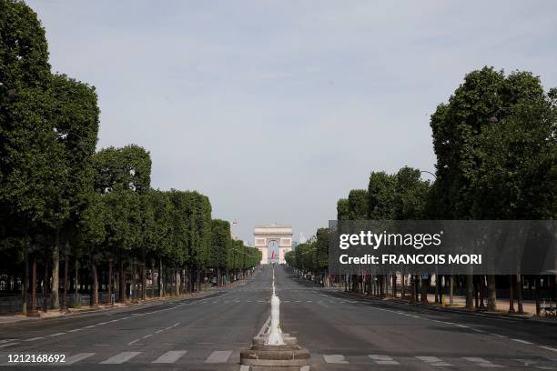 The Arc de Triomphe and the empty Champs Elysees avenue are pictured ahead of the start of the ceremony marking the 75th anniversary of World War II...