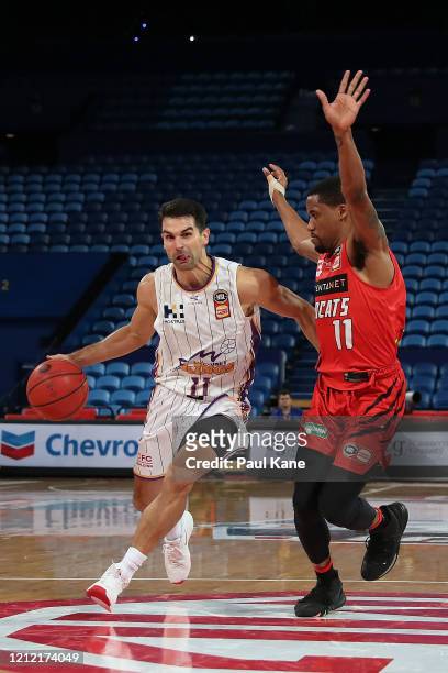 Kevin Lisch of the Kings drives to the key way against Bryce Cotton of the Wildcats during game two of the NBL Grand Final series between the Perth...