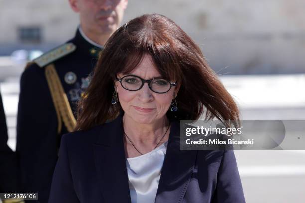 Greece's first woman president Katerina Sakellaropoulou at the Tomb of the Unknown Soldier after being sworn in at the Greek parliament on March 13,...