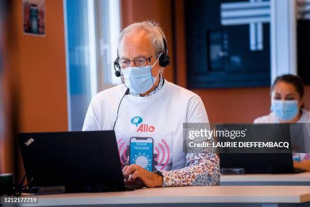 Call center operator pictured in action at a call center for 'contact tracing', where phonecalls are made to map how many people in Brussels have...