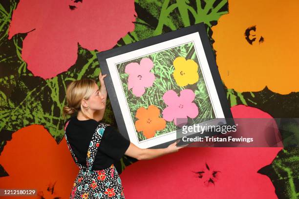 Andy Warhol’s ‘Flowers’ goes on view at Sotheby's on March 14, 2020 in London, England. The sale of the painting will take place on Thursday 19th...