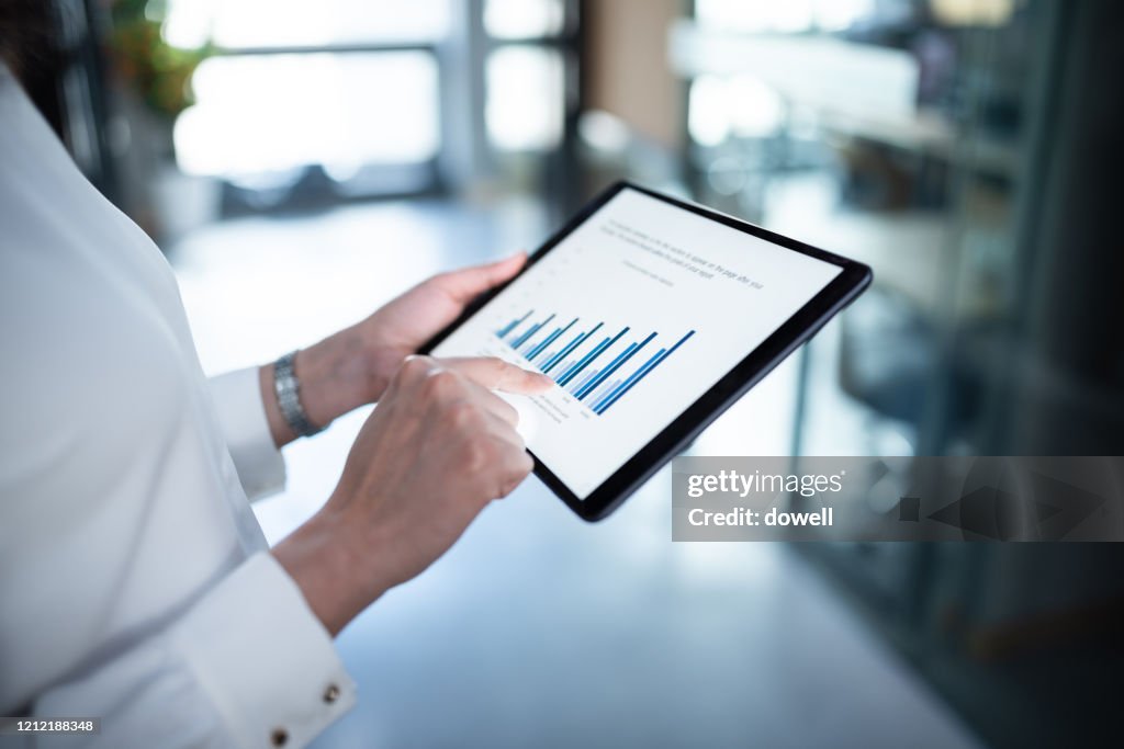Business report on digital tablet