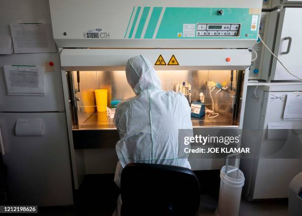 Molecular biologist William Dundon runs a test to detect whether a person has been infected with COVID-19, at the IAEA's Laboratories in Seibersdorf,...