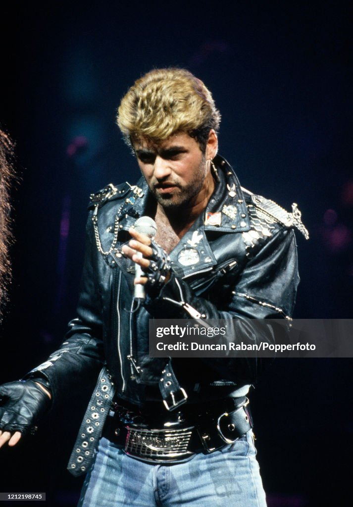 George Michael Instruments Singer George Michael performing during his first solo concert tour ...