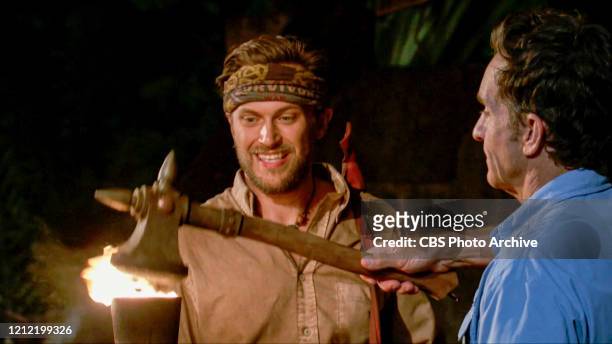 "The Penultimate Step of the War" - Jeff Probst extinguishes Nick Wilson\'s torch at Tribal Council on the two-hour Thirteenth episode of SURVIVOR:...