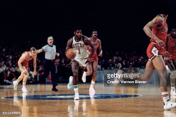 Oscar Robertson of Milwaukee Bucks handles the ball against the Chicago Bulls during a game circa 1971 at the MECCA Arena in Milwaukee, Wisconsin....