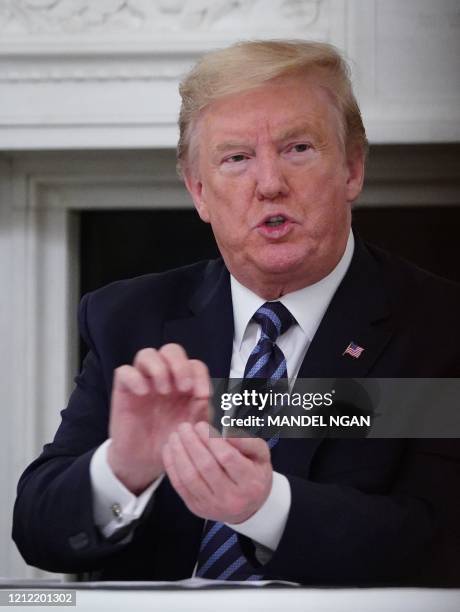 President Donald Trump speaks during a meeting with Republican members of the US Congress in the State Dining Room of the White House in Washington,...