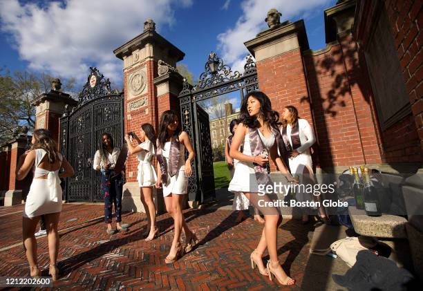 Brown University graduating seniors who call themselves the "Burnside Girls" gather for photos and a champagne toast on the University campus grounds...