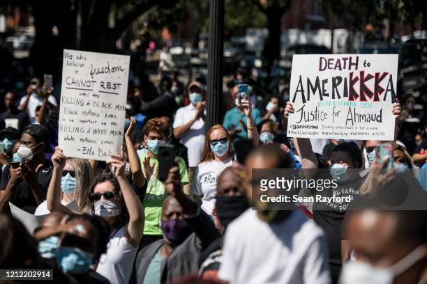 Demonstrators protest the shooting death of Ahmaud Arbery at the Glynn County Courthouse on May 8, 2020 in Brunswick, Georgia. Gregory McMichael and...