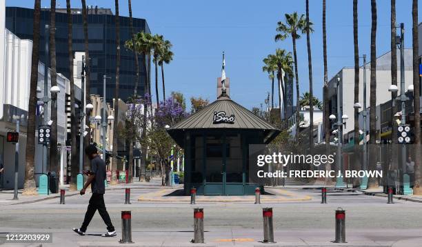 Businesses remain closed along the Third Street Promenade shopping street in Santa Monica, California on May 8 as some retailers across the state...