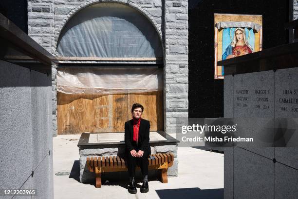 Lily Sage Weinrieb, a resident funeral director in Harlem, takes a rare break at St. Raymond New Cemetery in the Bronx on May 5, 2020 in New York...