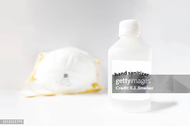 hand sanitizer and  dust mask - mascarilla stock pictures, royalty-free photos & images