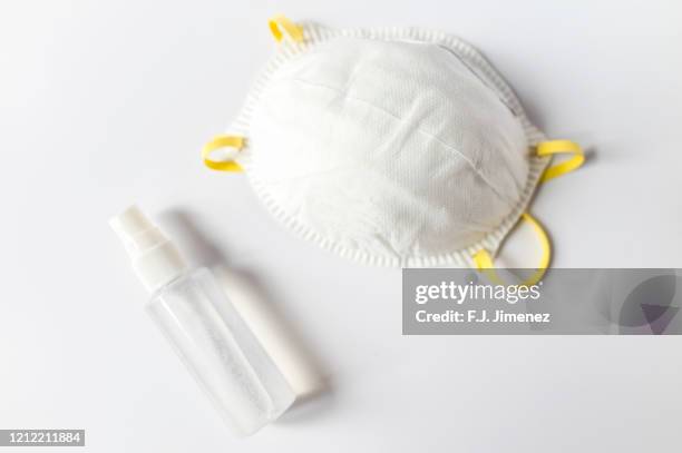 hand sanitizer and  dust mask - mascarilla stock pictures, royalty-free photos & images