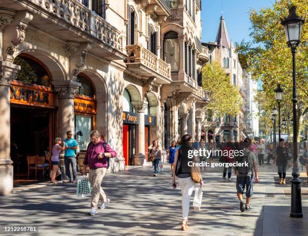pedestrians in barcelona - barcelona shopping stock pictures, royalty-free photos & images